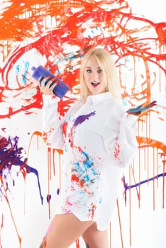Colorfully painted woman presents finger painting colors