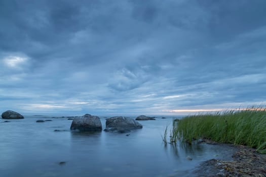 Calm Ocean with Rocks and Sea Weed.