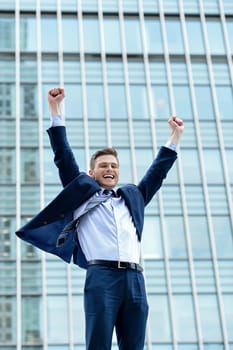 Portrait of a young businessman celebrating his success