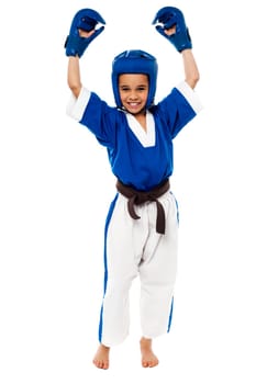 Little girl showing her success in raised arms