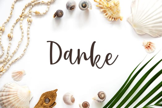 White Summer Flat Lay, Top View, Decorated With Shells and Plants, With German Text Danke, Means Thank You in English