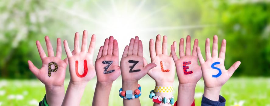 Children Hands Building Colorful English Word Puzzles. Sunny Green Grass Meadow As Background.