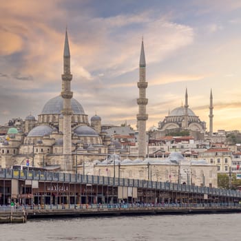 Istanbul, Turkey - August 31, 2022: Istanbul city view from Karakoy overlooking Golden Horn with Galata Bridge, Nuruosmaniye Mosque and Rustem Pasha Mosque, in a summer day before sunset