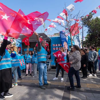 Istanbul, Turkey - May 13 2023: Supporters of Kemal Kilicdaroglu dancing while holding the Turkish flags in front of Republican Peoples Party kiosk in Uskudar neighbourhood during 2023 elections