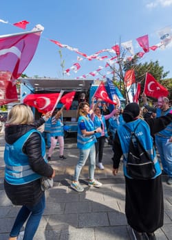 Istanbul, Turkey - May 13 2023: Supporters of Kemal Kilicdaroglu dancing while holding the Turkish flags in front of Republican Peoples Party kiosk in Uskudar neighbourhood during 2023 elections