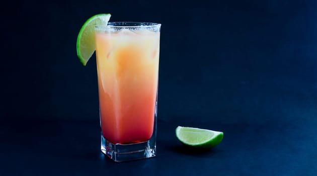 Tequila Sunrise drink on black background with copy or text space