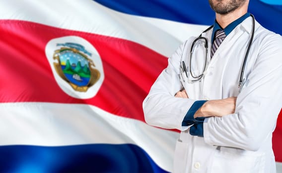 Costa Rica national health concept. Doctor with crossed arms on Costa Rica flag, Health and care with flag of Costa Rica