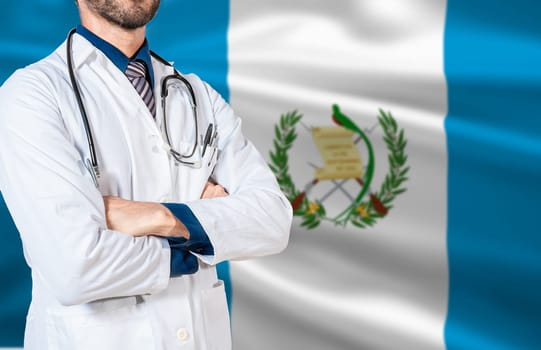 Health and care with the flag of Guatemala. Doctor with stethoscope on guatemala flag. Guatemala national health concept, Doctor arm with stethoscope on Guatemala flag
