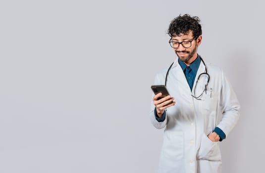 Smiling doctor using cellphone isolated. Young doctor with phone isolated, Doctor with phone on isolated background