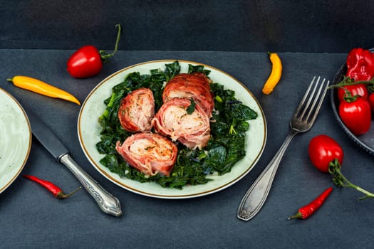 Fried chicken breasts roll or chicken roulade with spinach. Tasty ground chicken roll with filling
