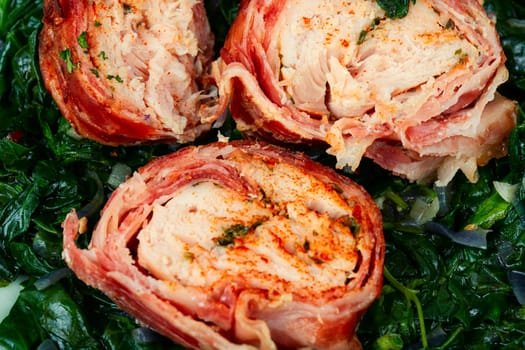 Fried chicken breasts roll or chicken roulade with spinach. Tasty ground chicken roll with filling