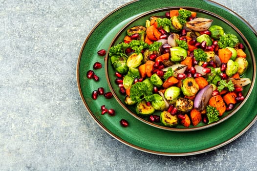 Bright dietary vegetable salad of cabbage, herbs and physalis. Homemade food.