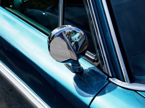 Sideview mirror of an old vintage car, conceptual vintage background with space for text