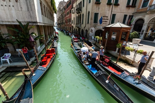 Venice, Italy - 06/08/2009 - Tourists visiting Venice on the characteristic Venetian gondolas