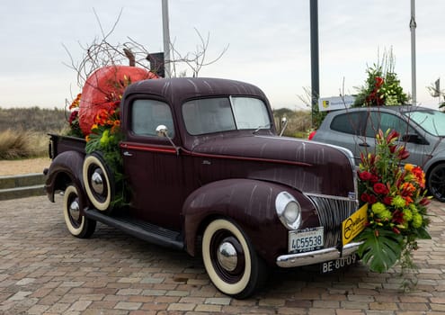Noordwijk, Netherlands - April 22, 2023: Cars decorated with flowers taking part in the Bloemencorso Bollenstreek the annual spring flower parade from Noordwijk to Haarlem in the Netherlands.