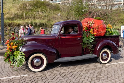 Noordwijk, Netherlands - April 22, 2023: Cars decorated with flowers taking part in the Bloemencorso Bollenstreek the annual spring flower parade from Noordwijk to Haarlem in the Netherlands.