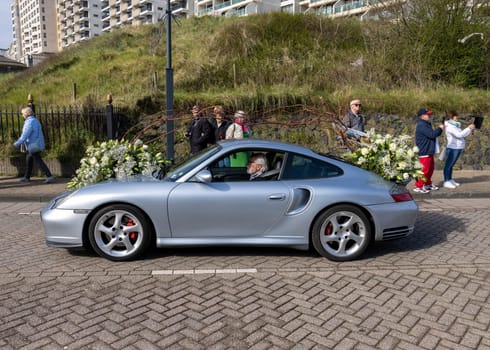 Noordwijk, Netherlands - April 22, 2023: Cars decorated with flowers taking part in the Bloemencorso Bollenstreek the annual spring flower parade from Noordwijk to Haarlem in the Netherlands.