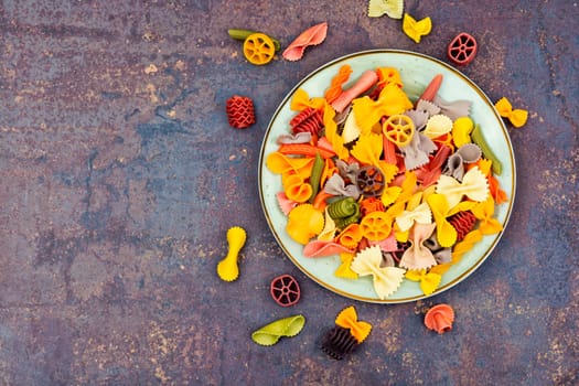 Colorful italian raw pasta or macaroni for kids.