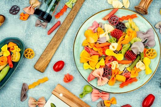 Colorful italian raw pasta or macaroni for kids.