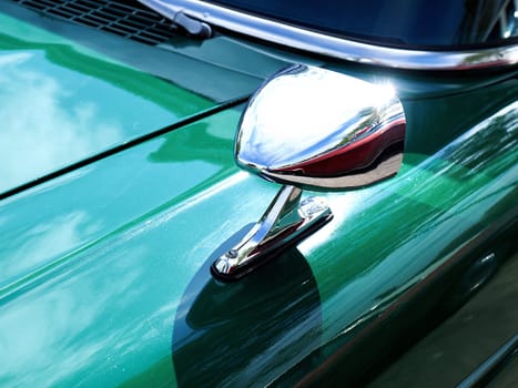 Sideview mirror of an old vintage car, conceptual vintage background with space for text