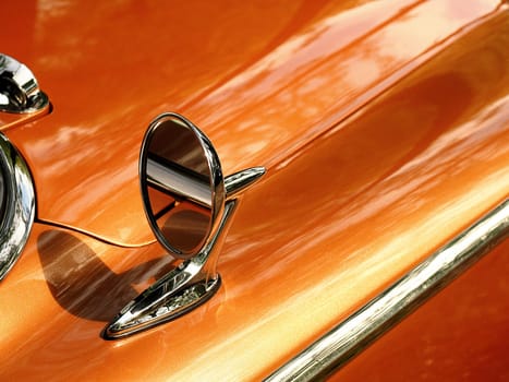 Sideview mirror of an old vintage car, conceptual vintage background with space for text