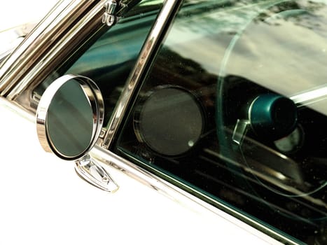 Sideview mirror of an old vintage car, conceptual vintage background with space for text