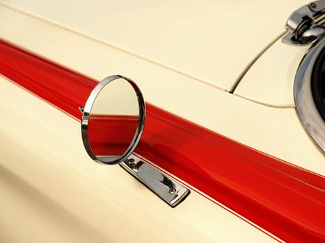Sideview mirror of an old vintage car, conceptual vintage background with space for text