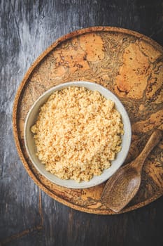 Freshly cooked bulgur in bowl. Bulgur wheat grains.