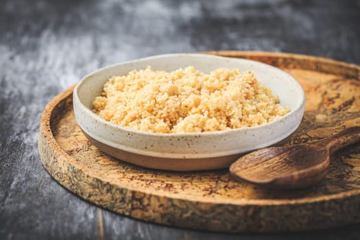 Freshly cooked bulgur in bowl. Bulgur wheat grains.