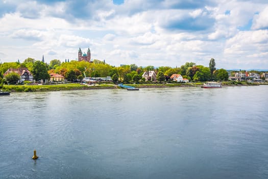 Speyer, Rhineland-Palatinate, Germany - 14 May 2023: Cityscape with harbor and Rhine river with cathedral in background