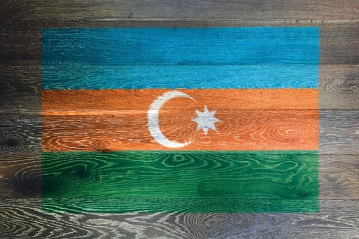 An Azerbaijan flag on rustic old wood surface background