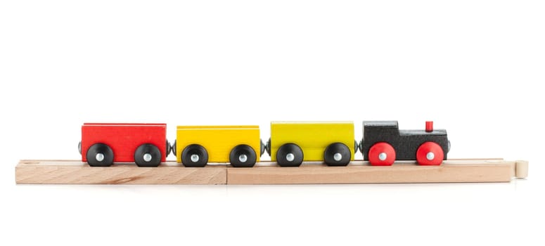 Wooden toy train. Isolated on white background