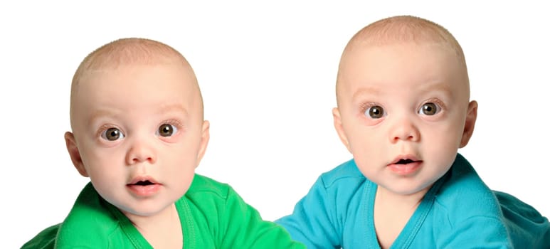 Twin baby boys in blue and green