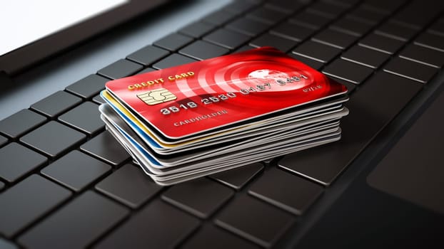 Credit cards standing on laptop computer keyboard. 3D illustration.