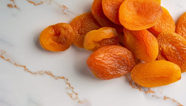 Dried apricots isolated on bright background. Healthy food concept. Close up view.