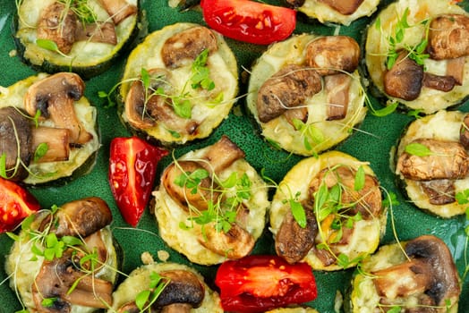 Diet food-fried zucchini with mushrooms and herbs. Roasted vegetables mix