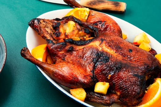 Roast duck stuffed orange and caramelized apples.