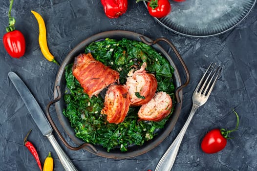 Sliced fried chicken roll with spinach garnish. Space for text
