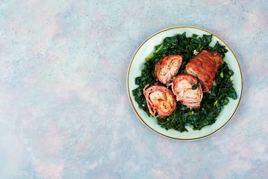 Sliced fried chicken roll with spinach garnish. Space for text