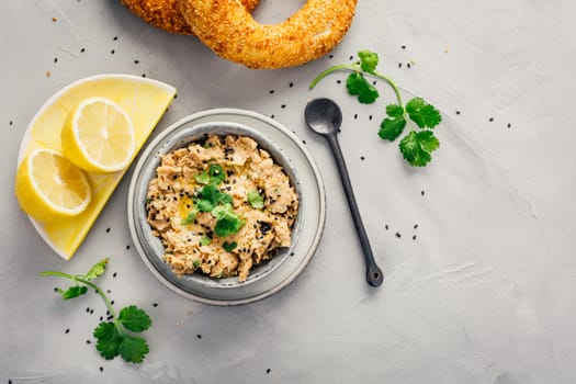 Vegan chickpea hummus spread with lemon and bagel