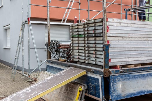 Modern house under construction with scaffold pole platform. New build domestic building