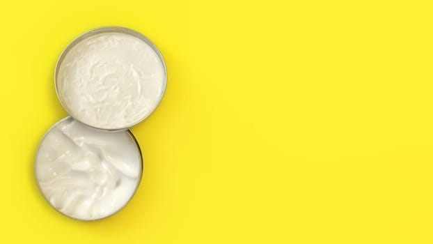 Tabletop view, metal round tin container with white cosmetic cream on yellow board, cap over the jar base, wide banner with text space right