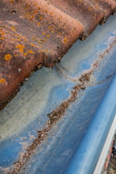 Roof gutter and downspout. Gutter cleaning and home maintenance concept