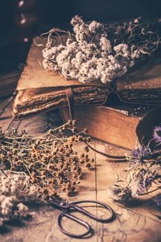 Dry flowers bouquets with old vintage diary and books, nostalgic vintage background