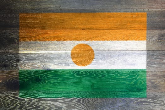 A Niger flag on rustic old wood surface background