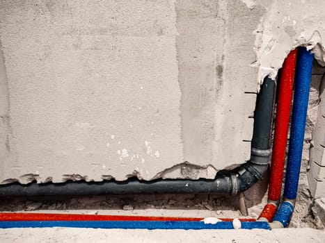 Wiring of plumbing pipes for water supply in a new house. Water main pipes. Plumbing wiring in a newly built apartment. Repair in the premises. Builder profession. Interior decoration.