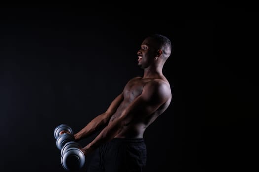 Portrait of athletic african american man topless smiling, yellow, red and black background