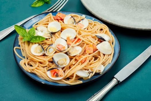 Pasta with clams, molluscs and spaghetti. Traditional italian seafood pasta
