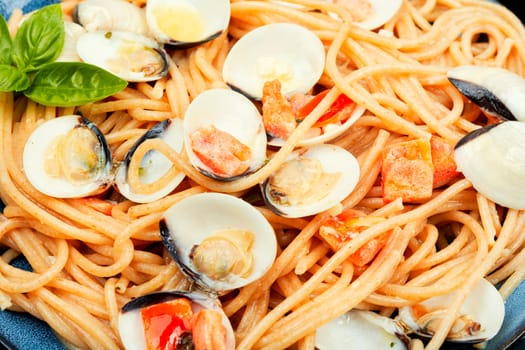 Pasta with clams, molluscs and spaghetti. Traditional italian seafood pasta
