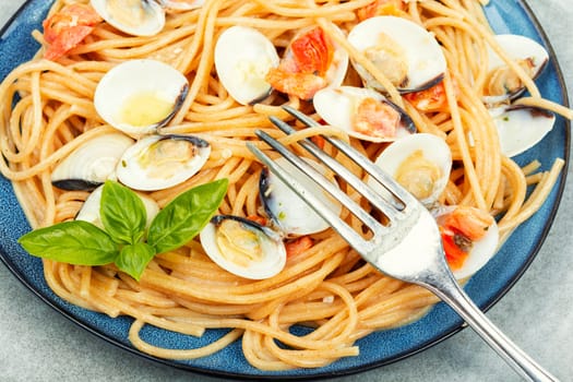 Pasta with clams, molluscs and spaghetti. Traditional italian seafood pasta